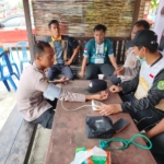 Datang ke Polsek Sangkulirang, Warga Benua Baru Ilir Bisa Curhat Sekaligus Cek Kesehatan Gratis